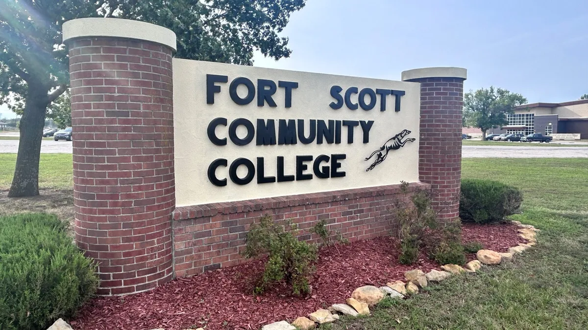 Fort Scott Community College campus sign with Greyhound mascot